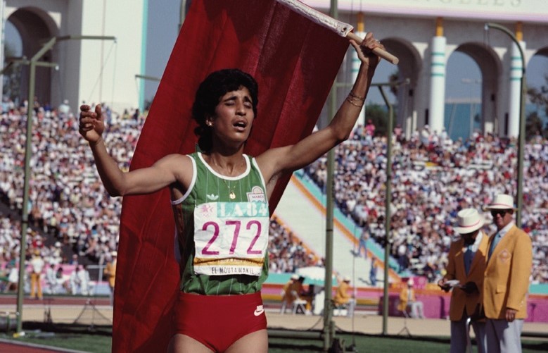 Moroccan athlete Nawal El Moutawakel wins the women's 400 metre hurdles at the Los Angeles Memorial Coliseum during the Summer Olympics, August 1984. (Photo by Tony Duffy/Getty Images)